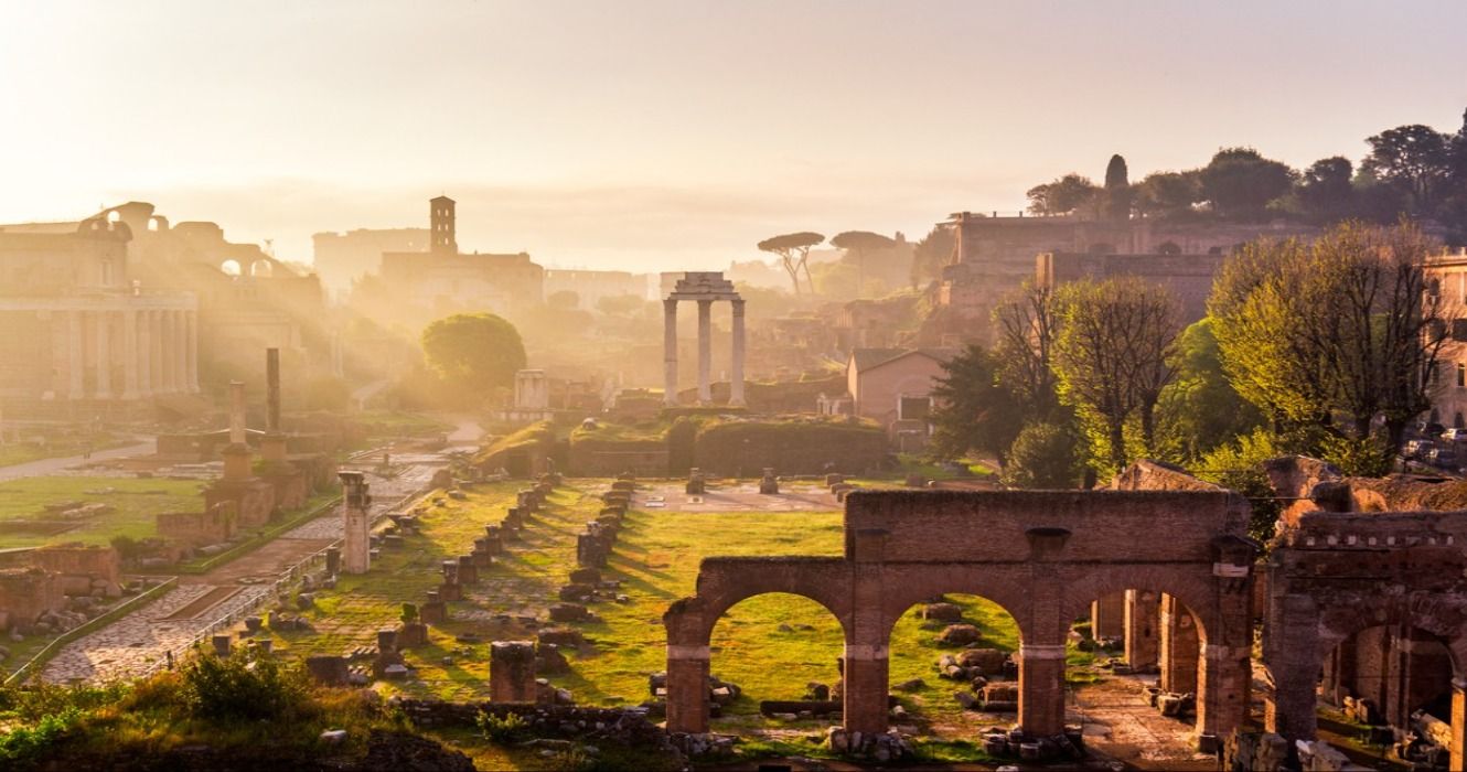 A view of Roman ruins at the Roman Forum in Rome, Italy, at sunrise