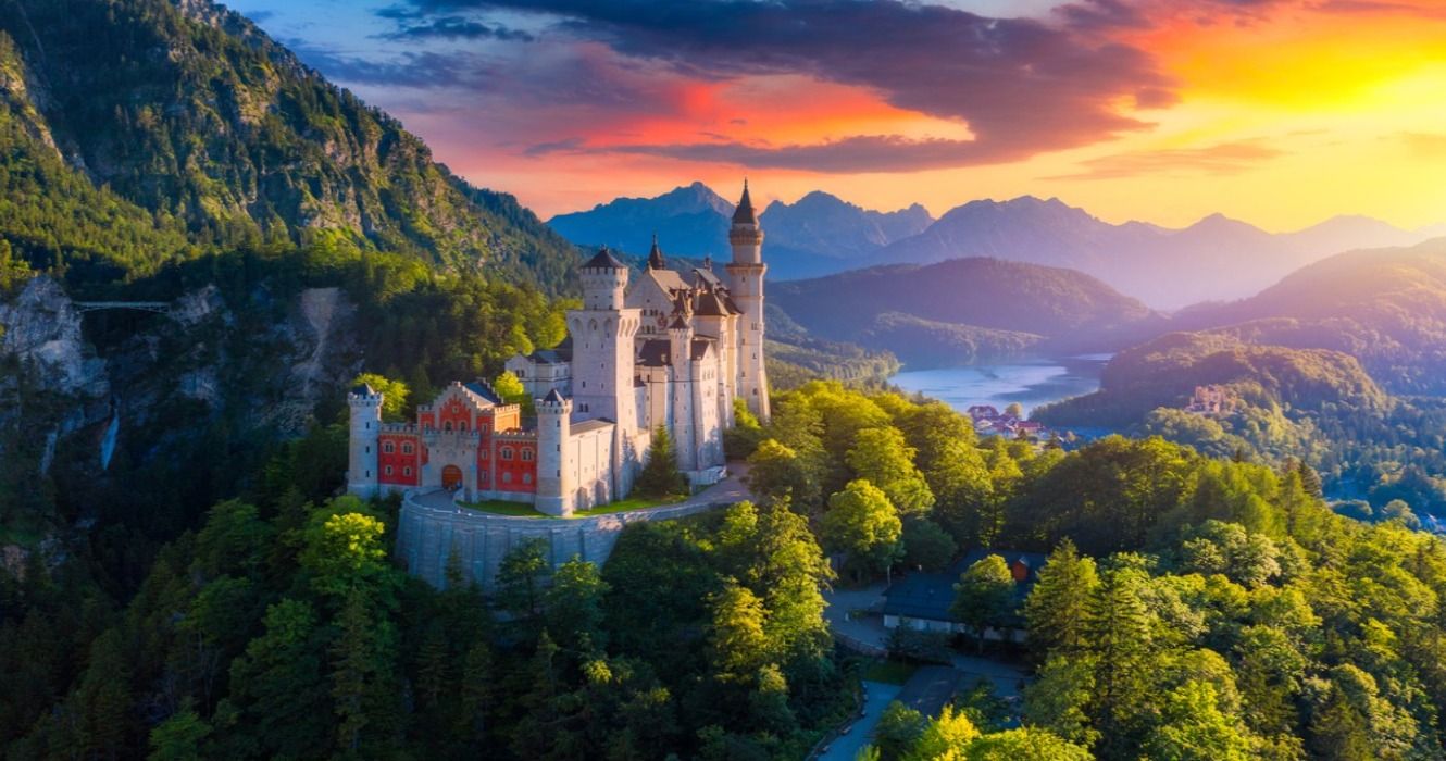 Aerial view of the Bavarian Neuschwanstein Castle against a scenic mountain landscape near Fussen, Bavaria, Germany