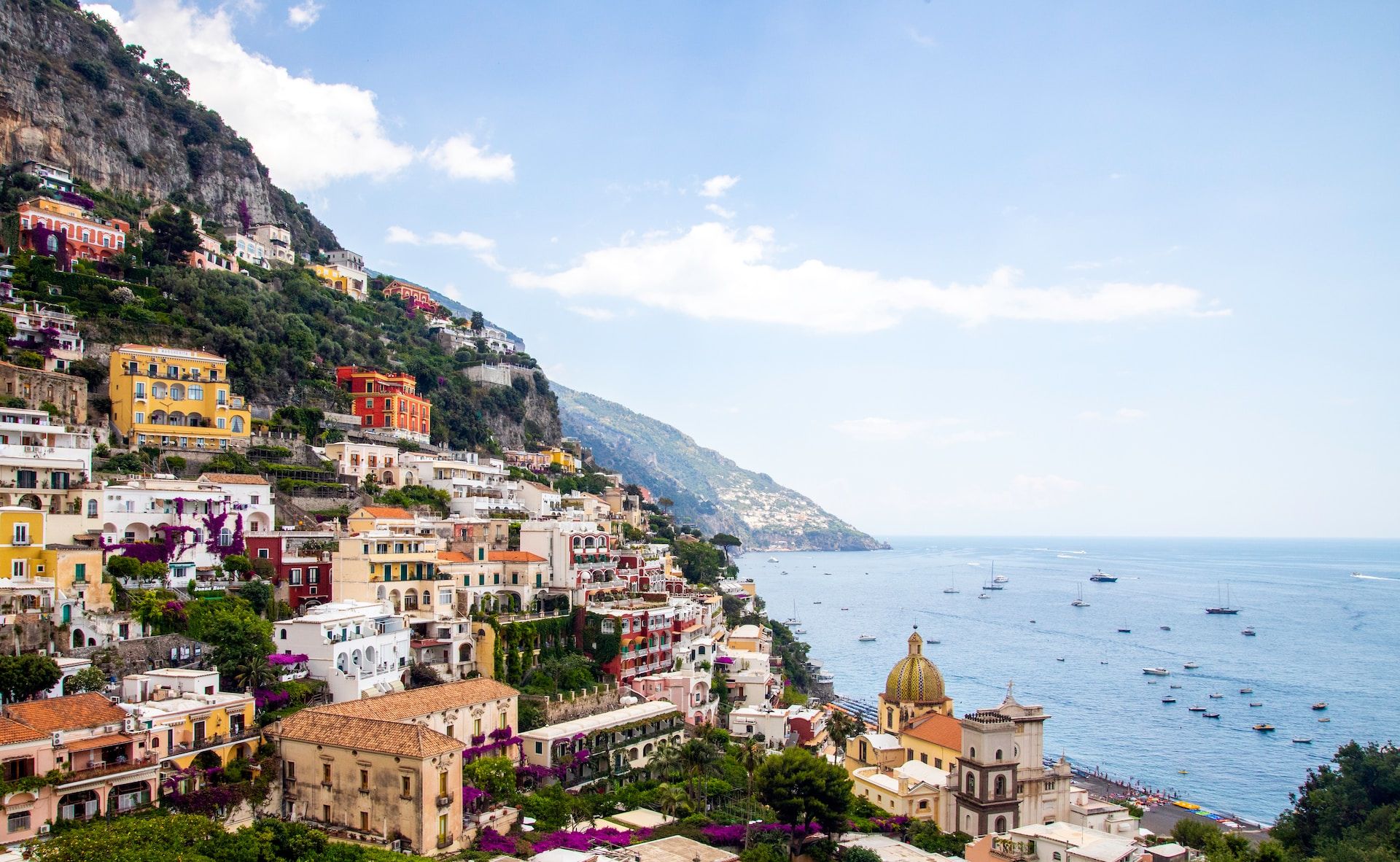 A beautiful view of Positano, with houses lined on a mountain, Italy