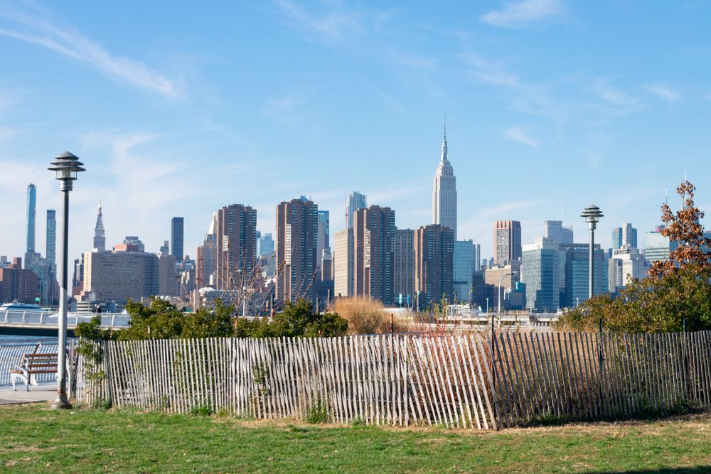 A section of WNYC Transmitter Park near Greenpoint, Brooklyn with Manhattan skyline