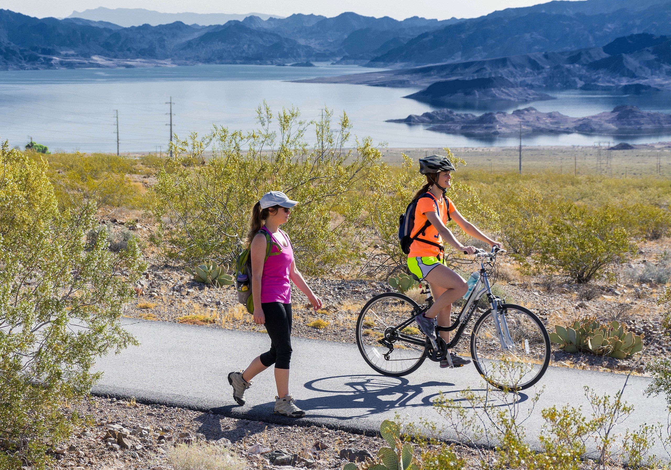 People Walking And Cycling on the River Mountains Loop Trail In Nevada, USA