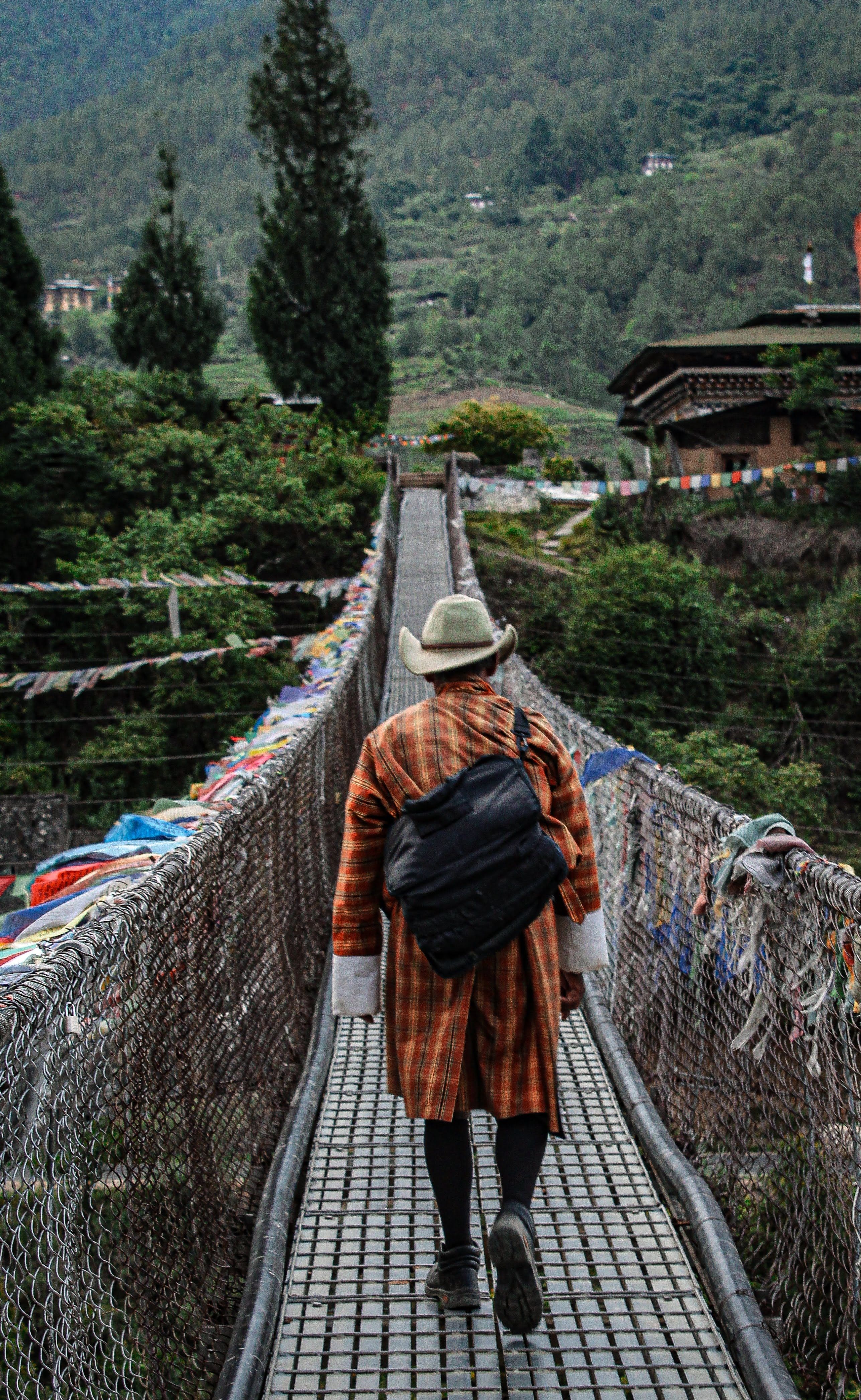Traveller crossing bridge in Punakha, Bhutan
