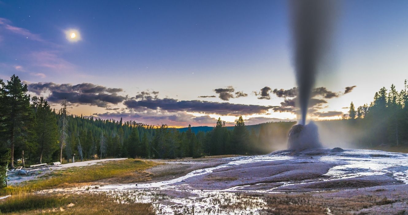 Lonestar Geyser during an eruption in winter at Yellowstone National Park