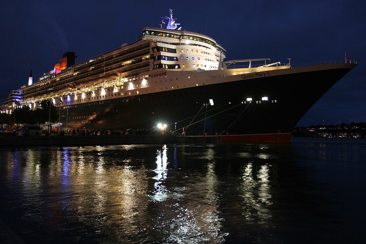  World's longest ocean liner Queen Mary 2, at night in Quebec City harbour
