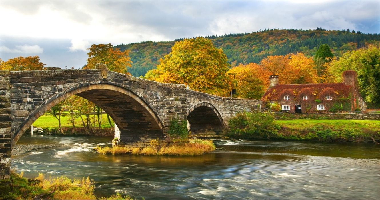 Fall foliage in the autumn at llanwrst Bridge in Snowdonia National Park, North Wales, UK, United Kingdom