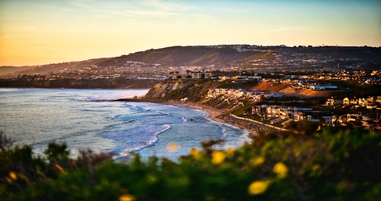 A sunset view of the town and beach in Dana Point, California, USA