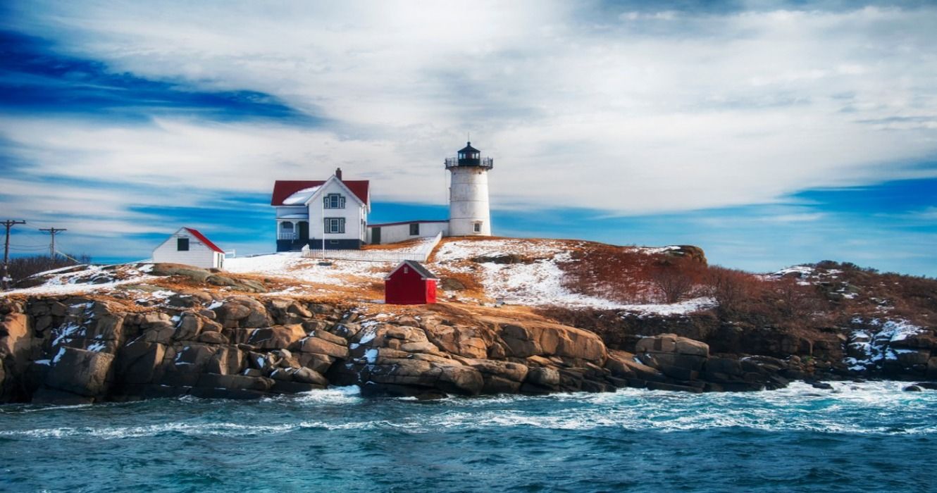 Snow in the winter at The Cape Neddick Nubble Lighthouse in Cape Neddick, York County, Maine, New England, USA