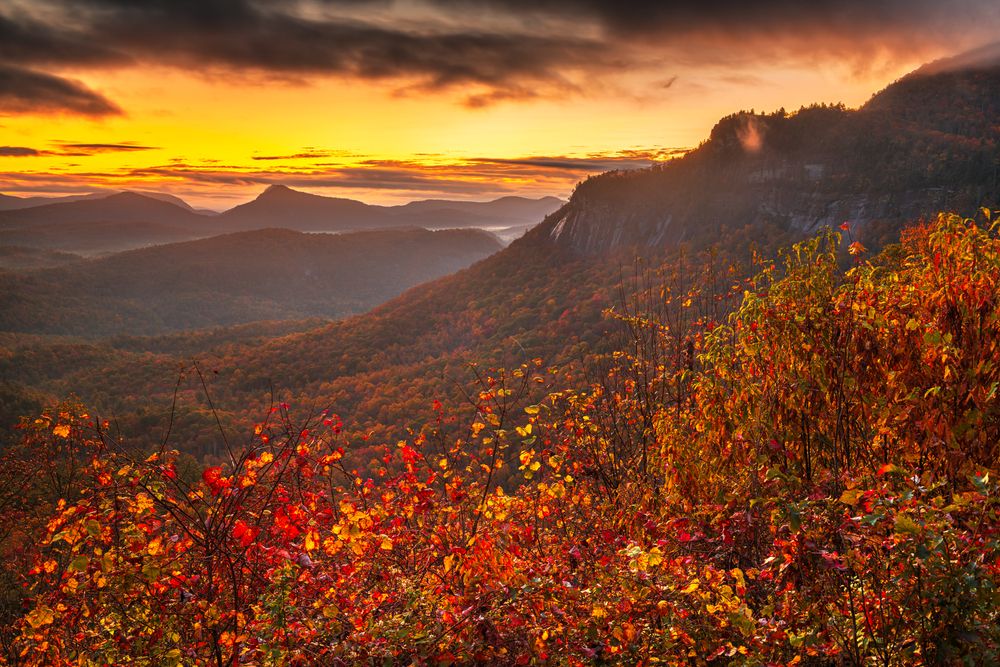 Whiteside Mountain covered with fall foliage in the autumn in the mountains of North Carolina, USA