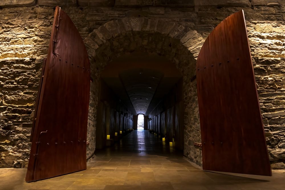 The large wooden doorway to the catacombs at St. Patrick's Old Cathedral, New York City, USA