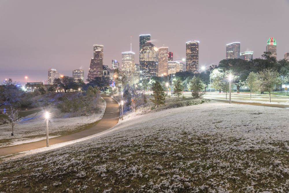Downtown Houston covered in snow in the winter seen from Eleanor Tinsley Park, Texas, USA