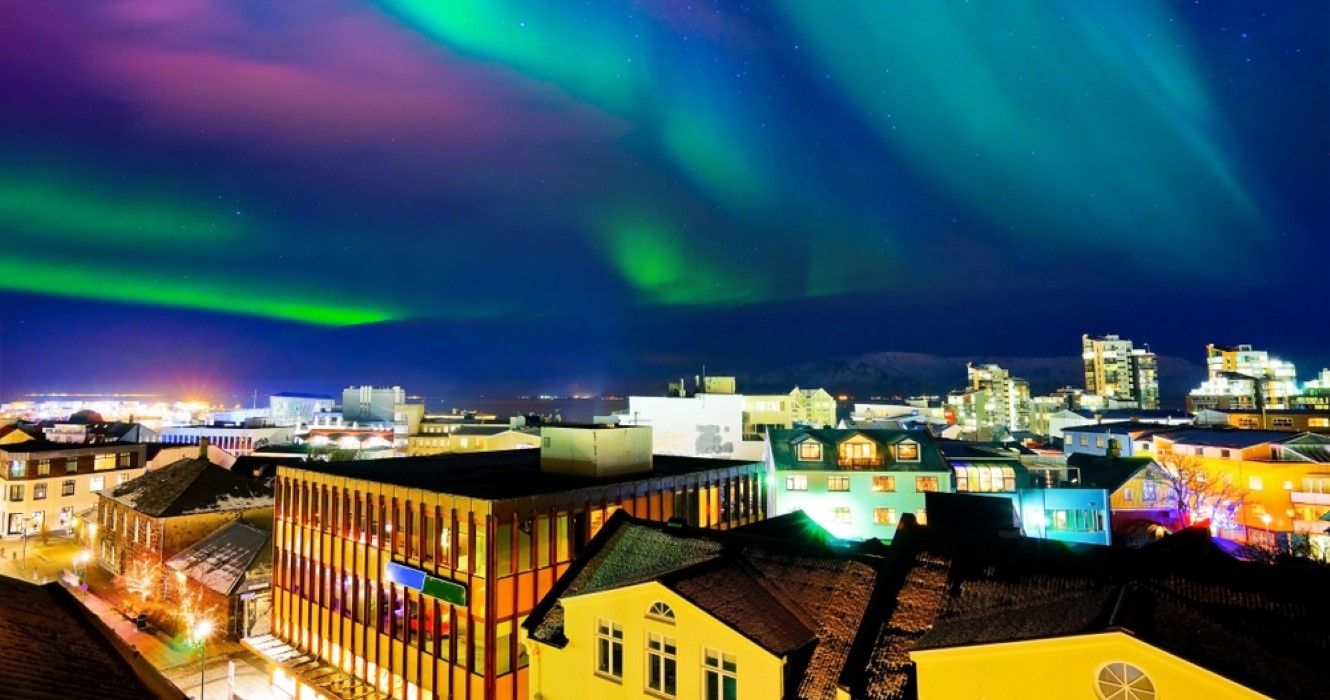 View of the northern light from the city center in Reykjavik, Iceland
