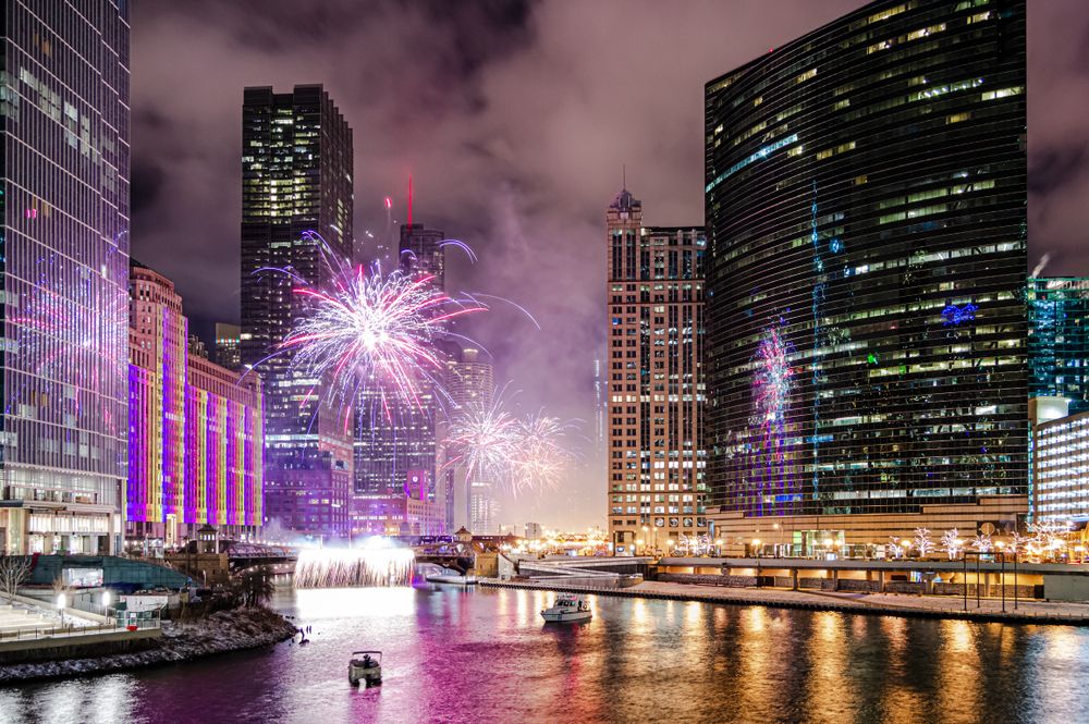 A beautiful nighttime display of fireworks near the Chicago River at Wolf Point in Chicago, Illinois