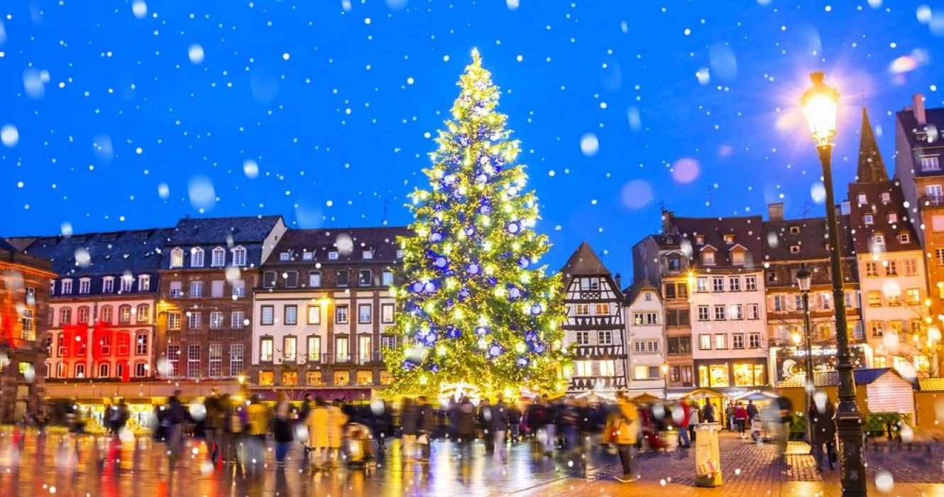 Christmas tree and xmas market at Kleber Square at night in medieval city of Strasbourg - capital of Noel, Alsace, France