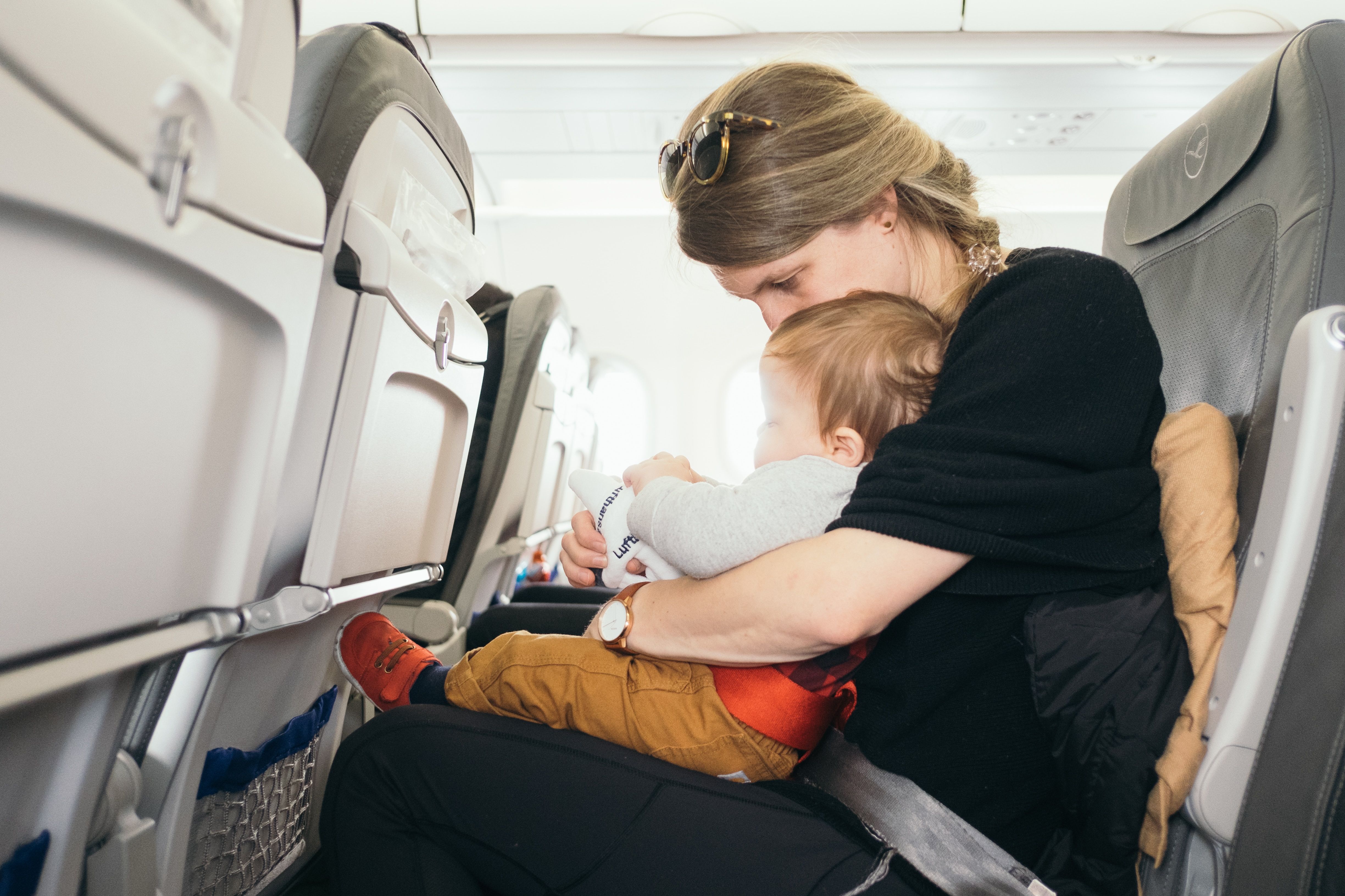 Woman and baby in a plane