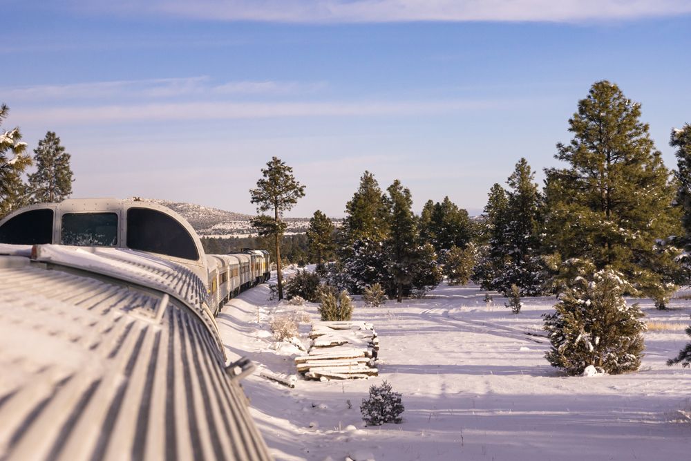 Grand Canyon Railroad train going through snow in the winter, Williams, Arizona, USA