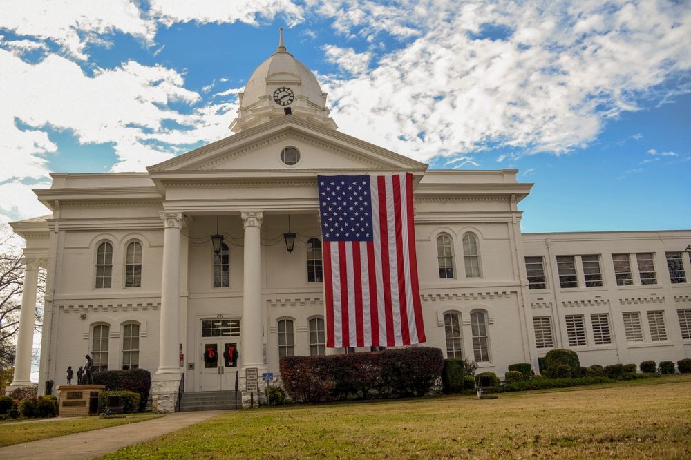 Colbert County Courthouse with the American flag, Tuscumbia, Alabama, AL, USA