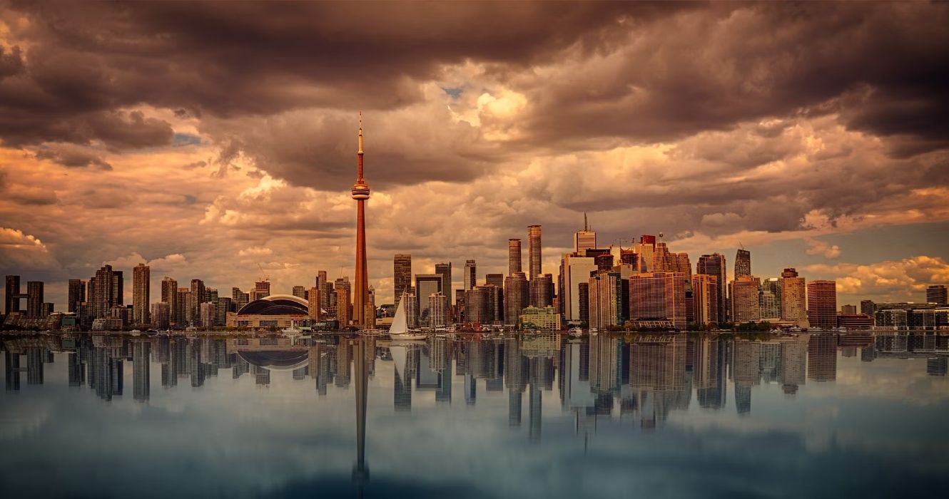Toronto skyline at sunset over the water