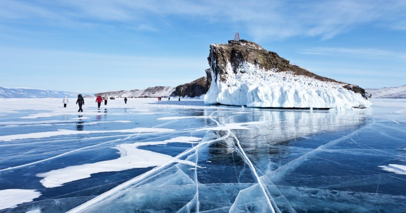 Tourists traveling along frozen Lake Baikal, Russia