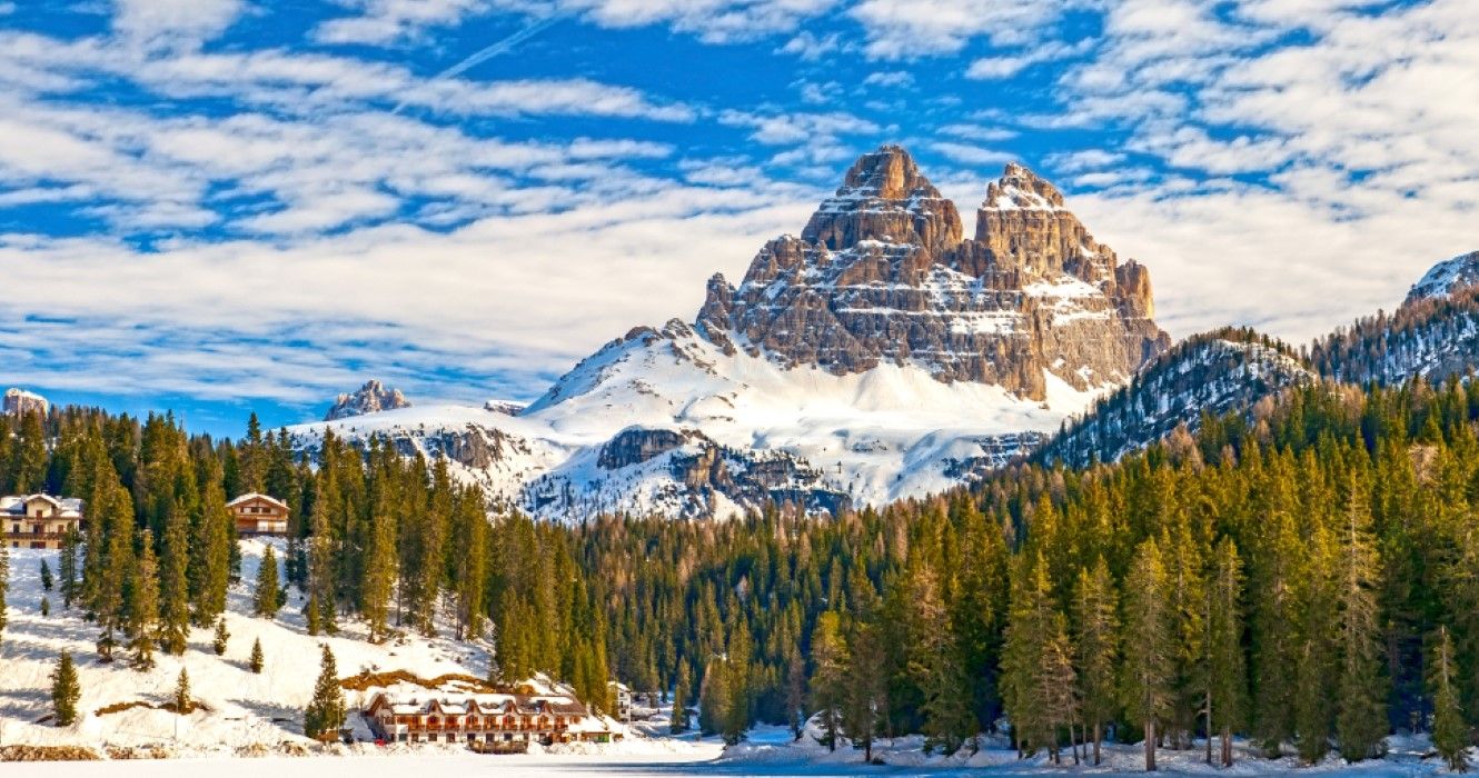 Tre Cime di Lavaredo peaks seen from Misurina lake in Dolomites, Italy in winter