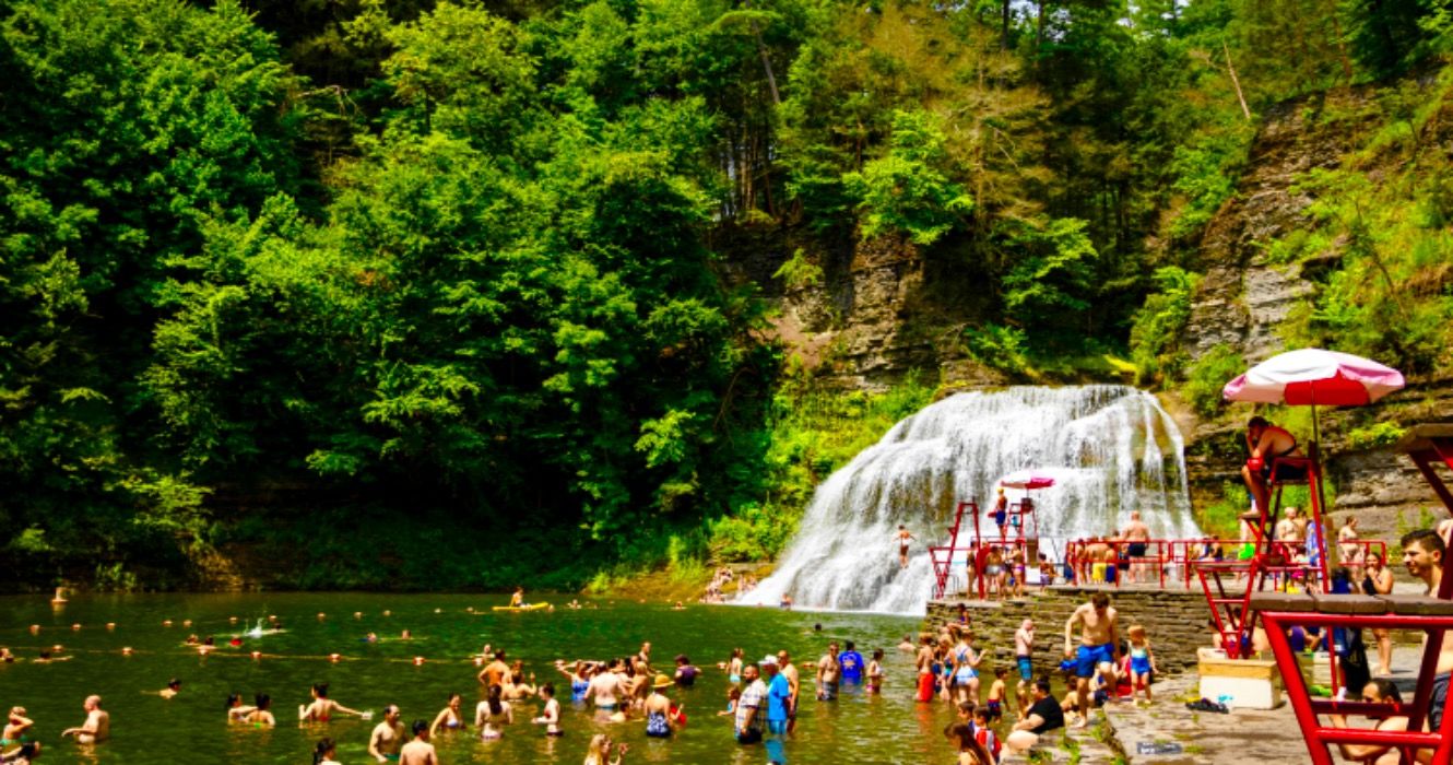 Swimmers enjoy swimming hole at Enfield Falls (Lower Falls)