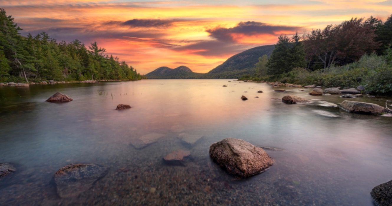 Colorful sunrise at Jordan Pond in Acadia National Park Maine