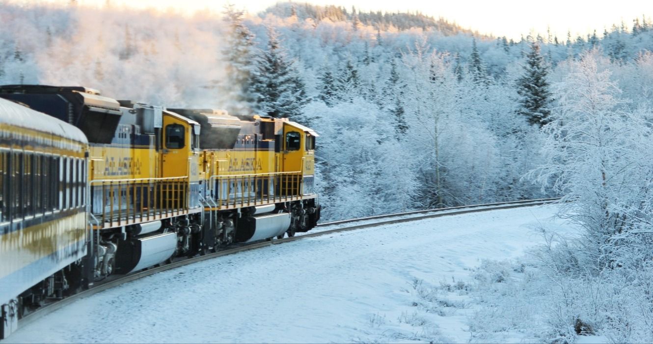 The Aurora Winter Train on the Alaska Railroad in the winter surrounded by snow, USA