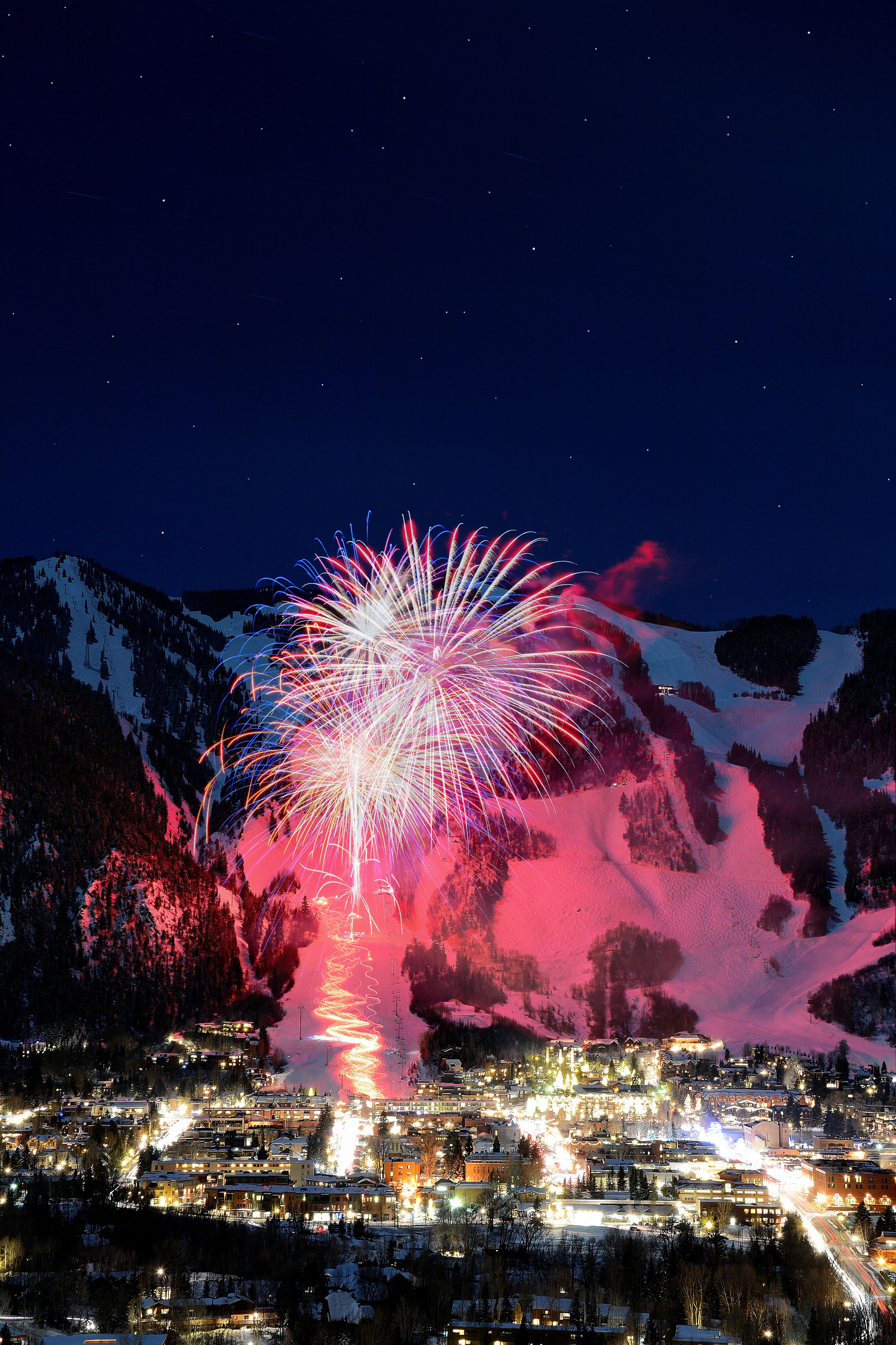 Aspen Mountain Town in Colorado on New Year's Eve with fireworks in winter, Aspen, Colorado, CO, USA