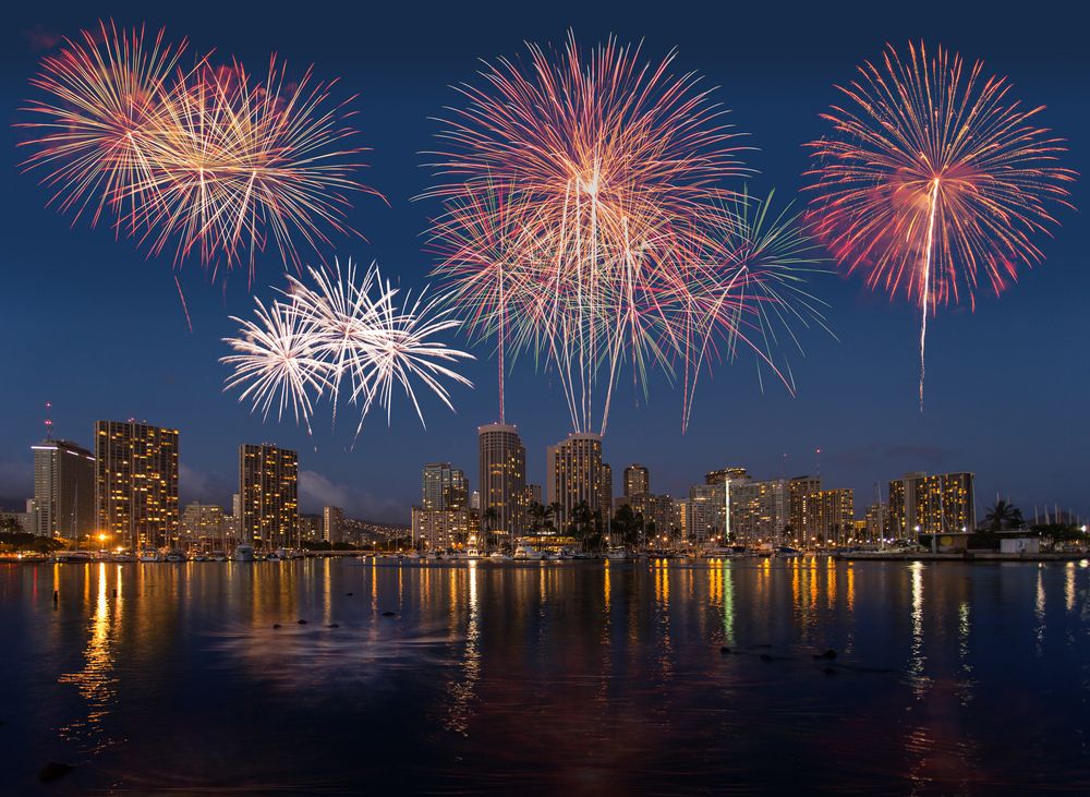 Colorful fireworks over the Honolulu skyline at night in Hawaii, HI, USA