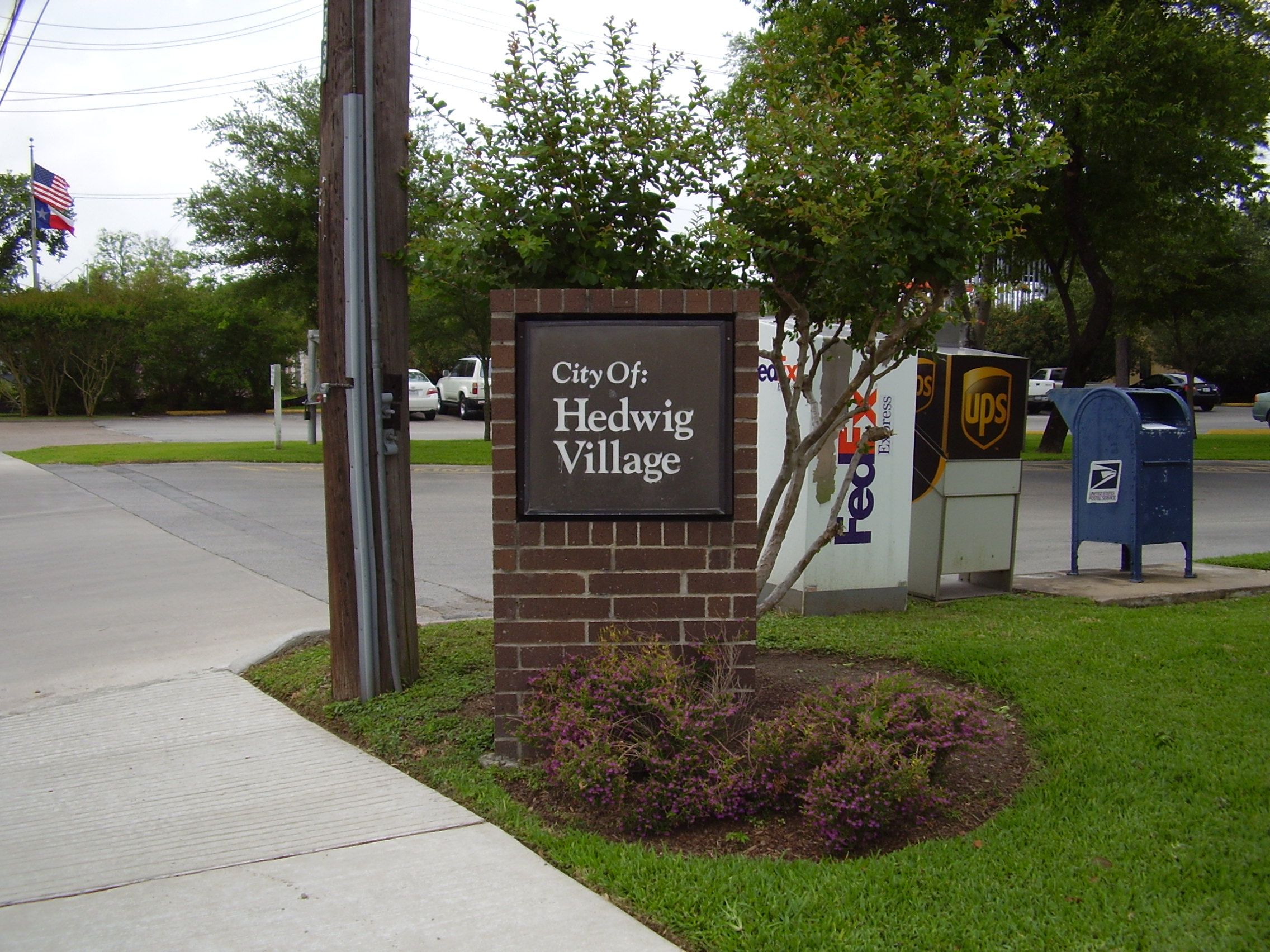 Sign indicating Hedwig Village, Texas