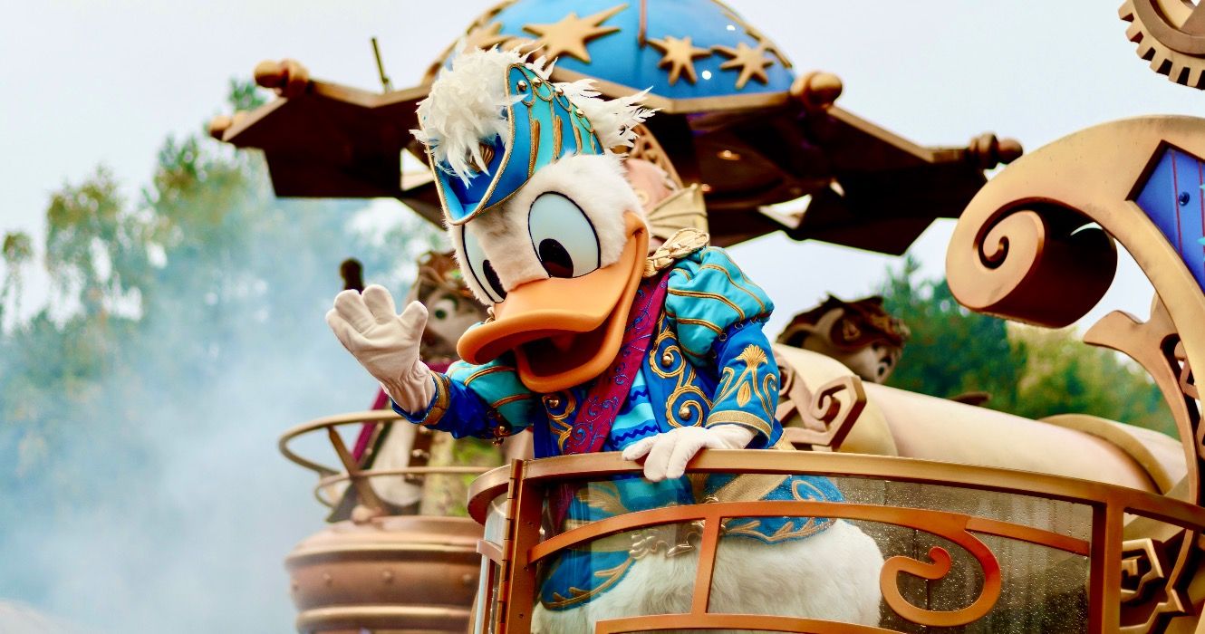 Donald Duck in a float during a parade in Disneyland Paris park.