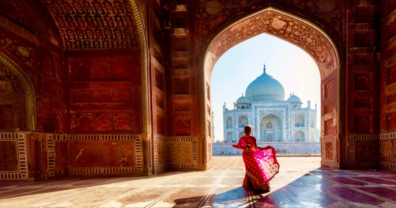 Woman in red saree/sari in the Taj Mahal, Agra, Uttar Pradesh, India
