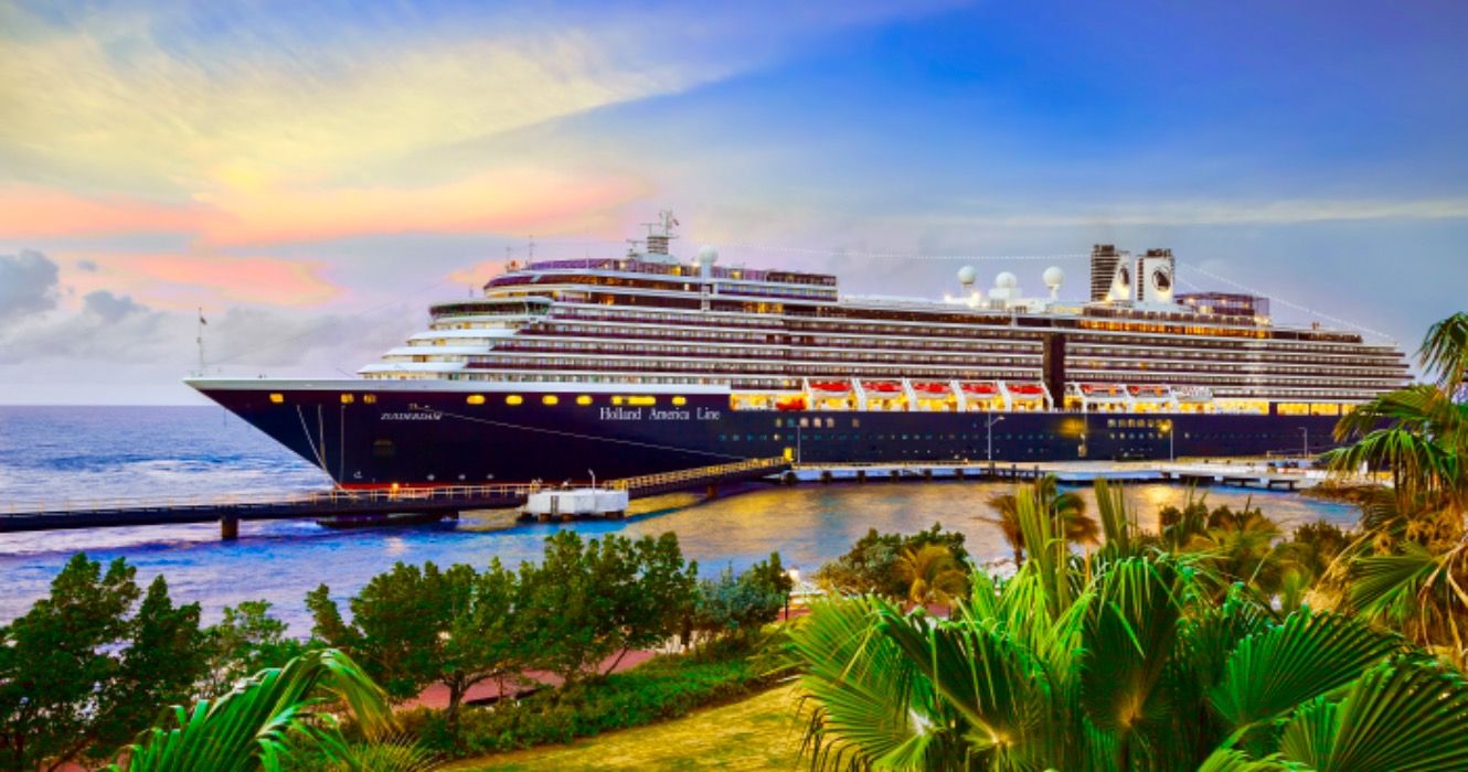 Cruise ship Zuiderdam, Holland America Line, docked at port Willemstad on sunset.