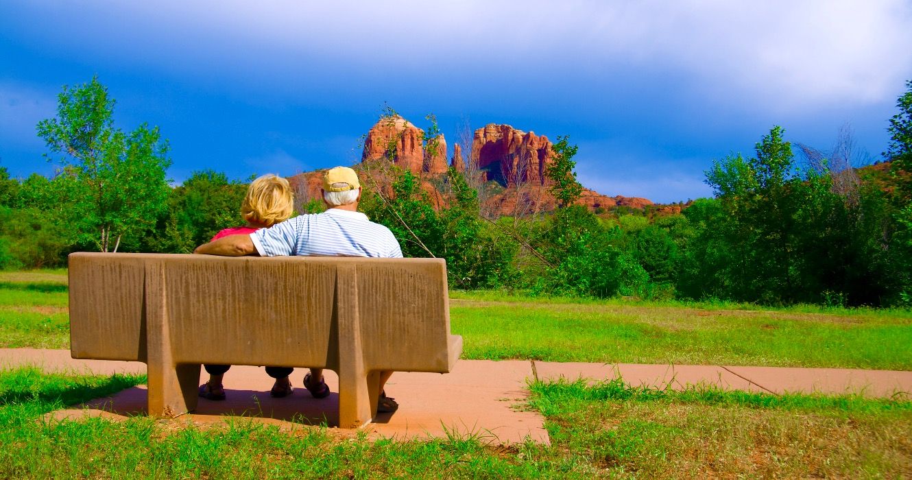 Retired couple sitting on bench in Arizona