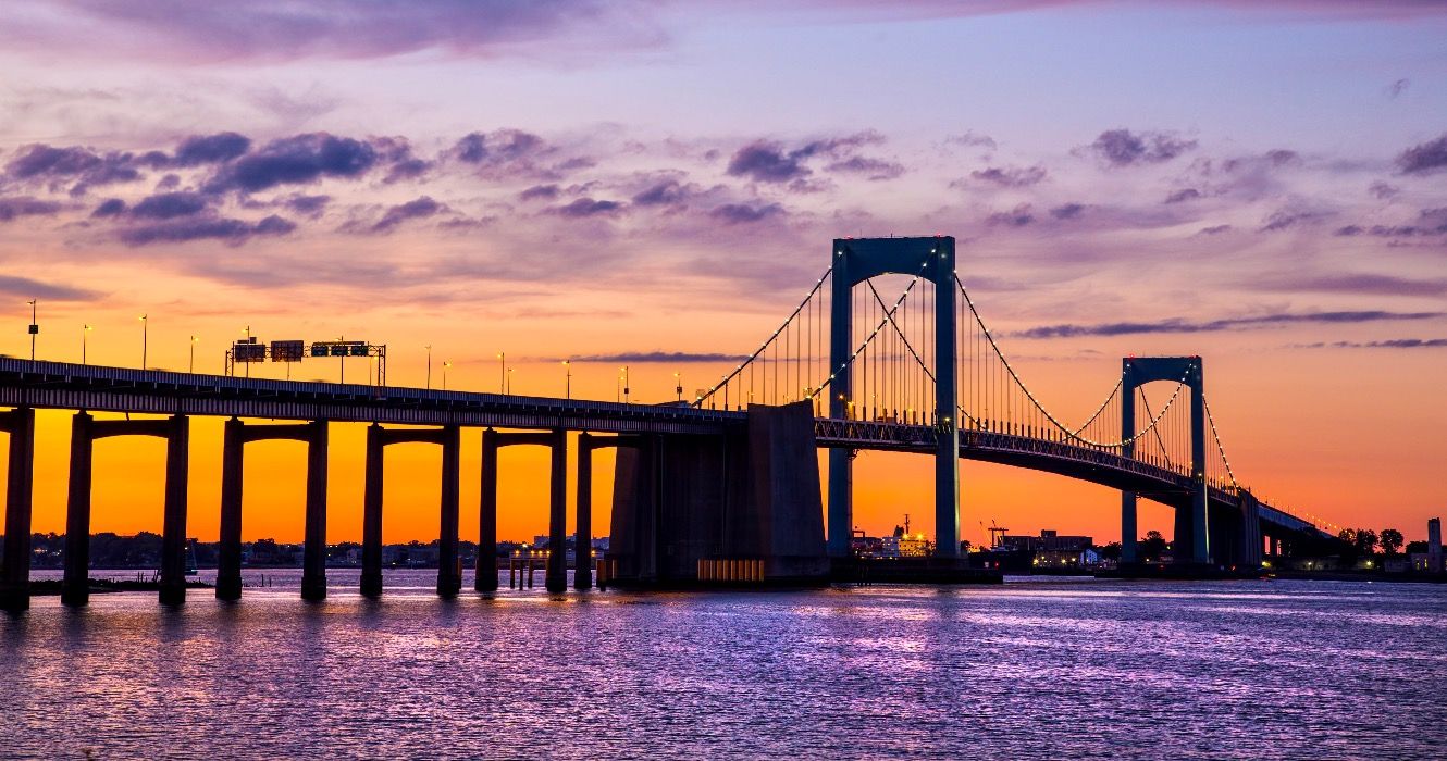 Colorful sunset over Long Island Sound and Throgs Neck Bridge in New York City