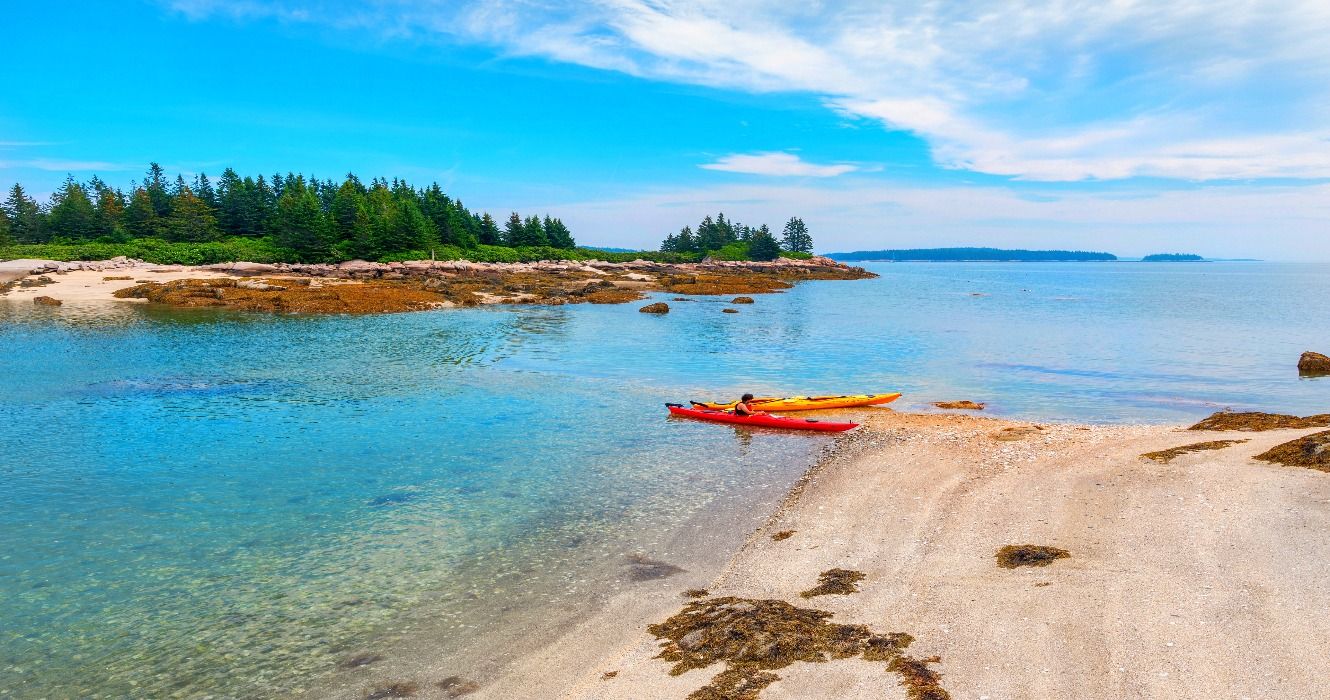 Kayaks on the shores of a beach on Deer Isle, Maine, ME, USA