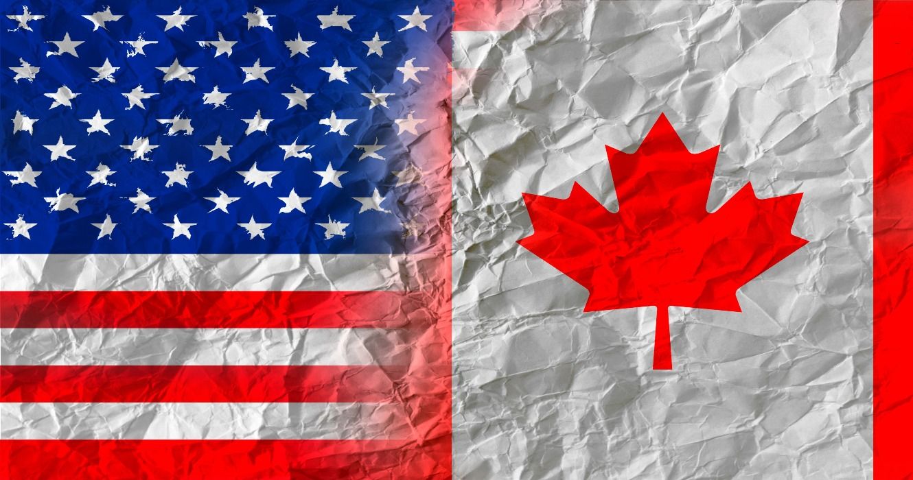 A USA American flag and a Canadian Canada flag merged together