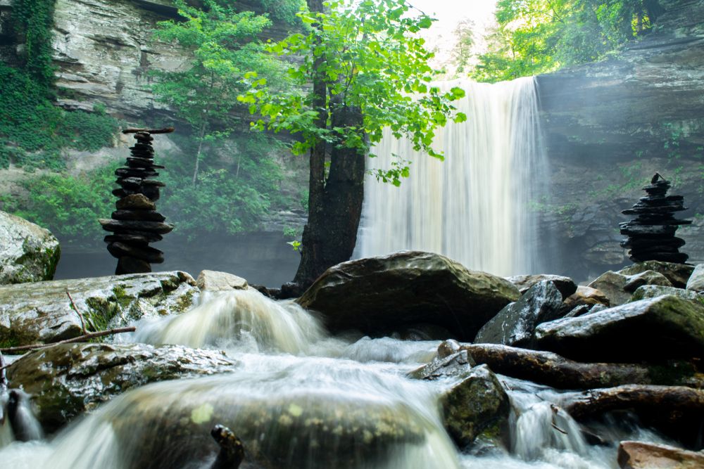 Greeter Falls behind cairns and rocks in the South Cumberland Gap area of Beersheba Springs, Tennessee, TN, USA