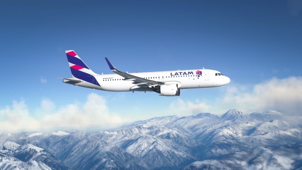 An AirBus a320 LATAM Airlines plane flying over Andes Mountains, Santiago, Chile