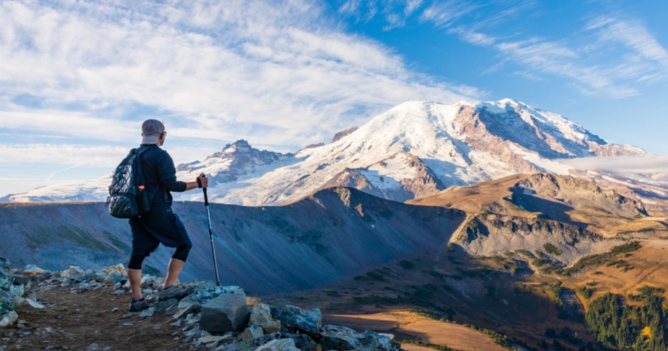 A Hiker looking at Mount Rainier
