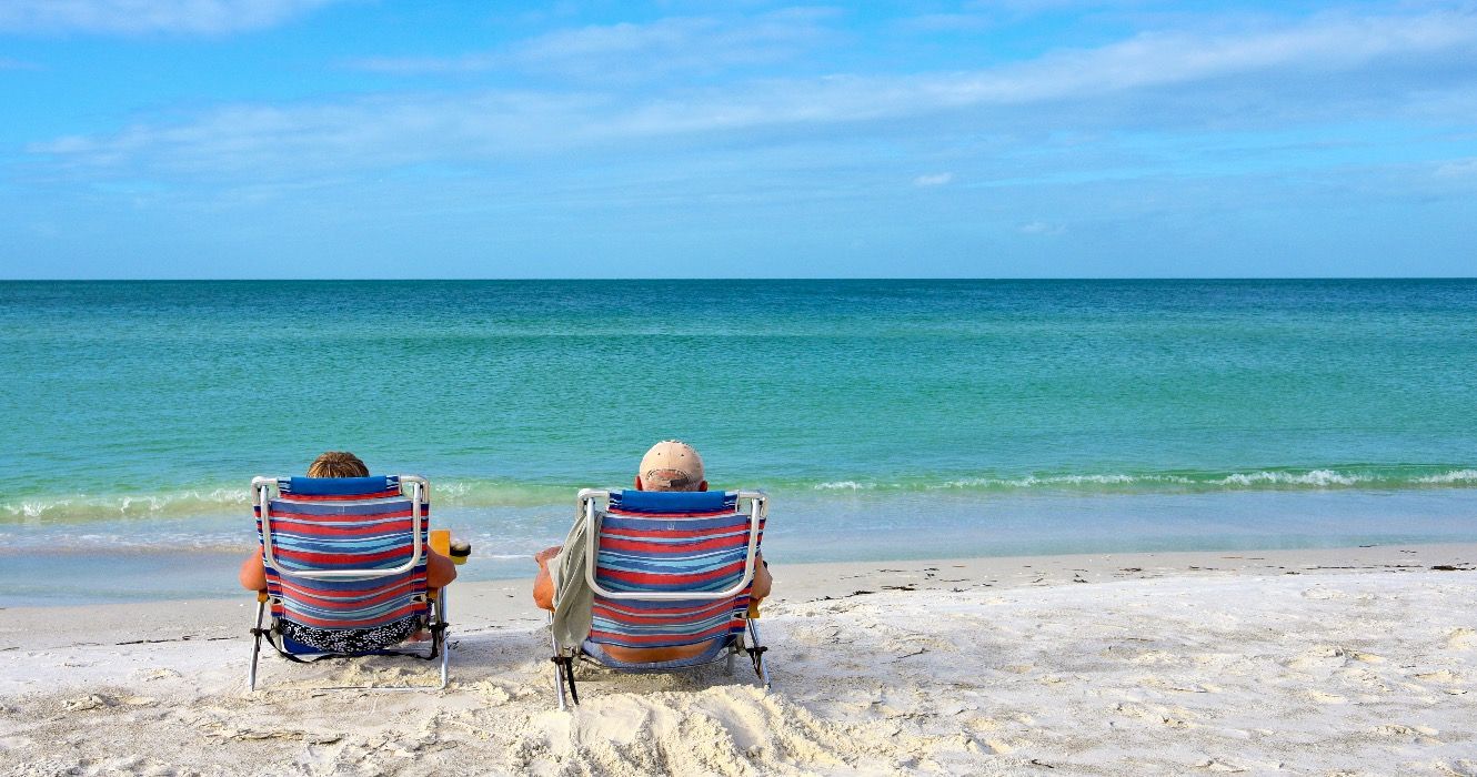 Elderly couple enjoying a day at the beach, Florida