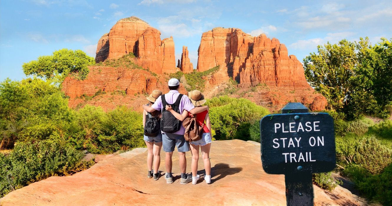 People on hiking trip enjoying view of Cathedral Rock, Sedona, Arizona, USA