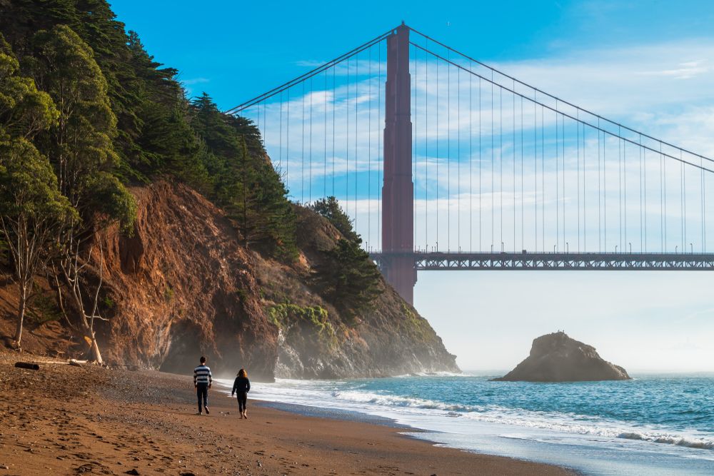 A Couple Walking at Kirby Cove Overlooking Golden Gate Bridge, California