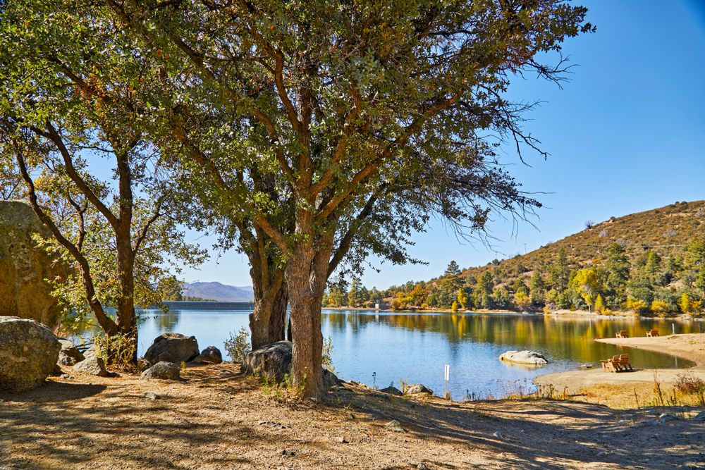 Goldwater lake dam surrounded by trees and mountainous landscapes in Prescott, Arizona 