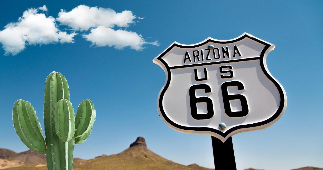 A scenic view of a historic Route 66 sign