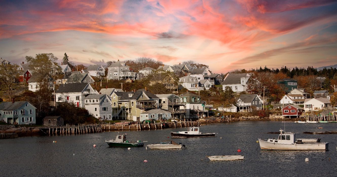 Lobster boats at anchor and bay front homes, Stonington, Maine
