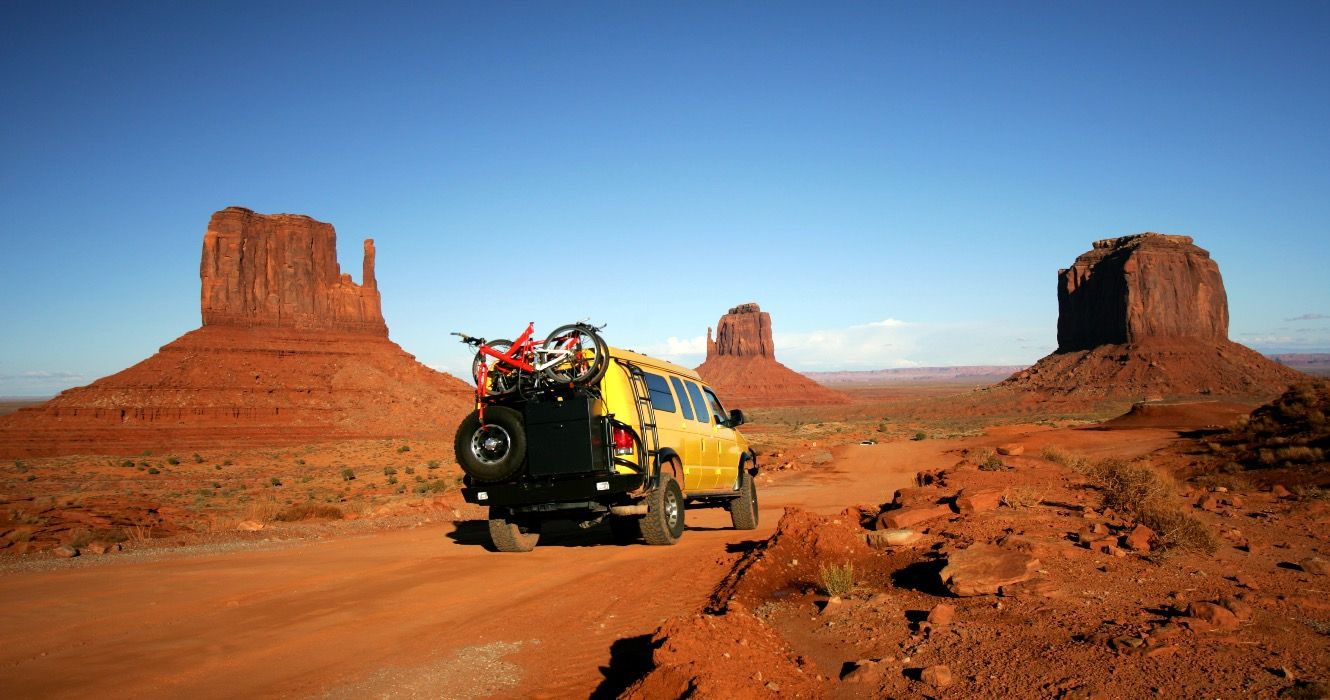 Yellow Van with Mountain bikes in Monument Valley