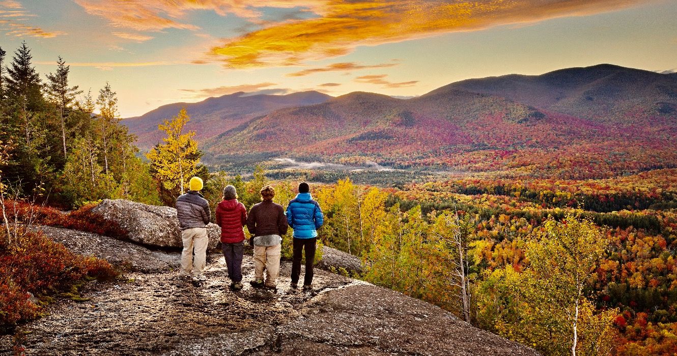 group of hikers enjoying the view in the Adirondacks