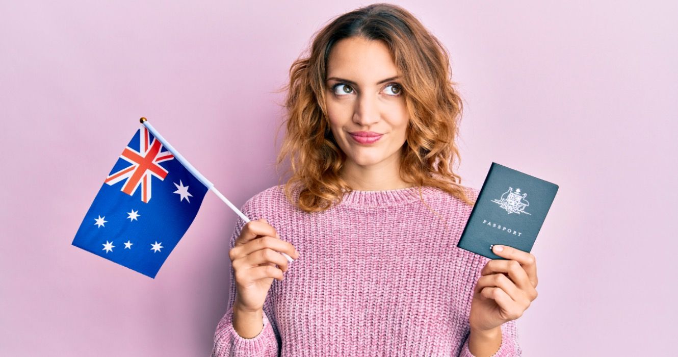 Young woman holding Australian holiday visa