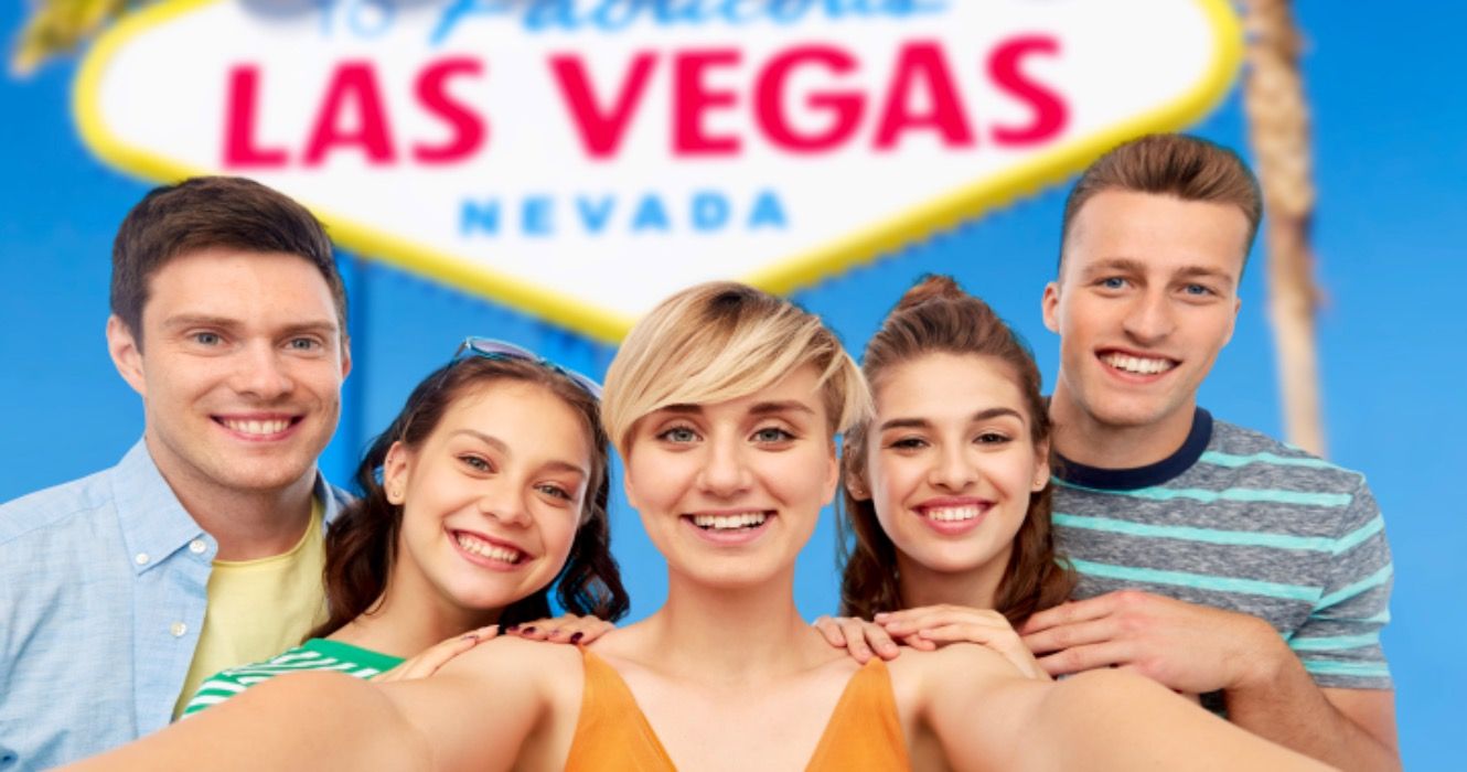 Group of friends posing in front of Welcome to Las Vegas sign