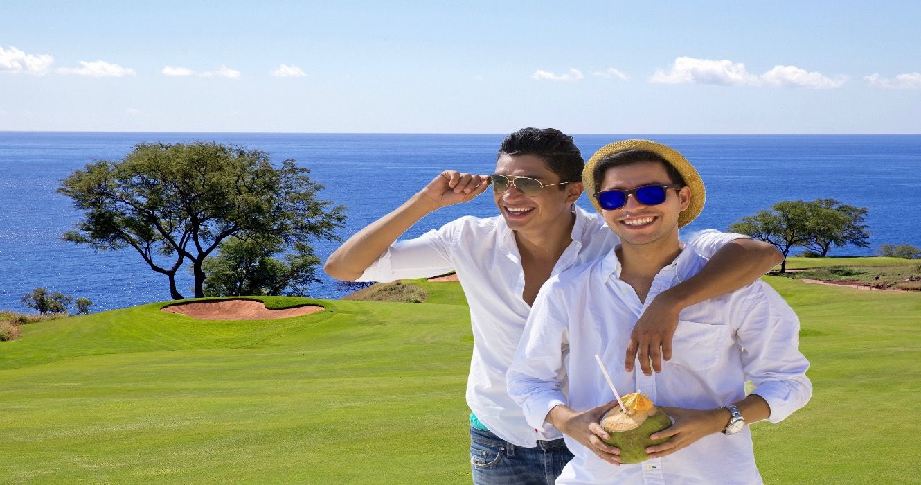 Travelers on golf course in Manele, Hawaii